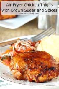 Air Fryer Chicken Thighs with Brown Sugar and Spices Served on a White Plate with Pasta and Bread