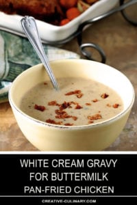 White Gravy from Old Fashioned Pan Fried Chicken Drippings in a Yellow Serving Bowl