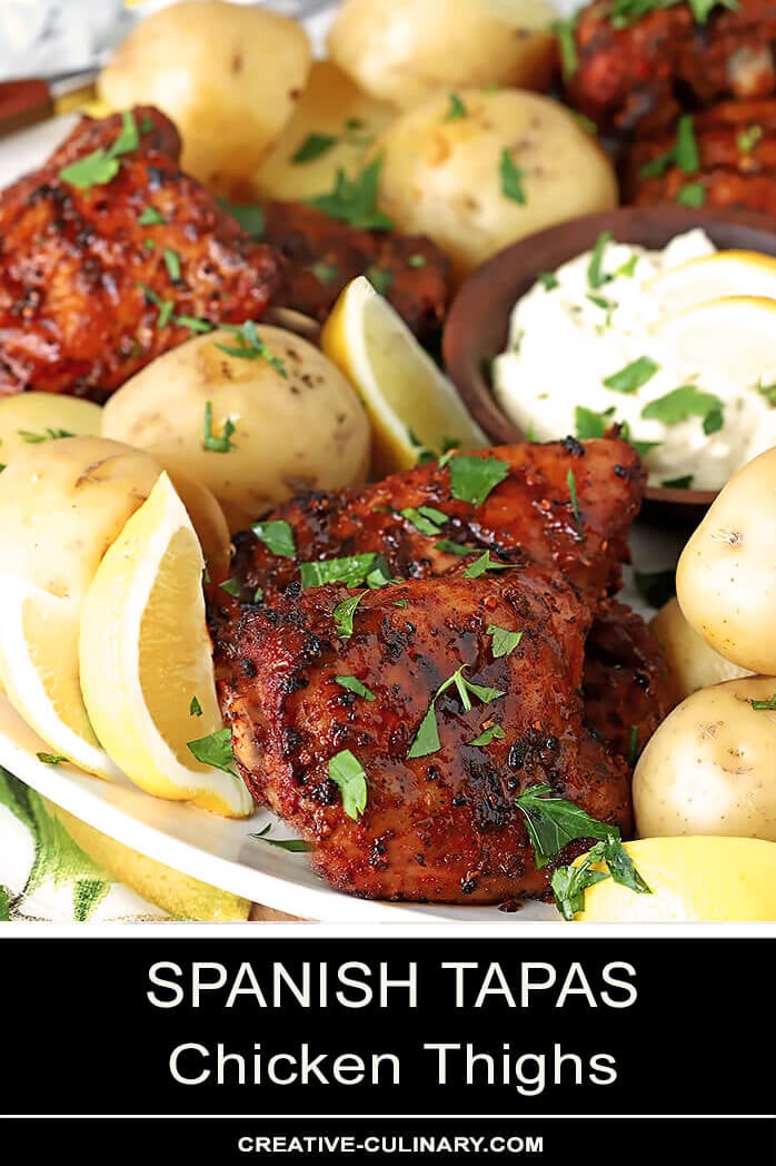 Spanish Tapas Chicken Thighs Served on a Large Platter with Potatoes and Garlic Aioli