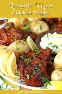 Spanish Tapas Chicken Thighs Served on a Large Platter with Potatoes and Garlic Aioli