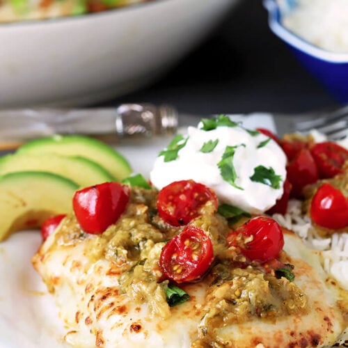 Tomatillo Salsa Verde Chicken Breasts Served with Cherry Tomatoes, Avocado and Sour Cream