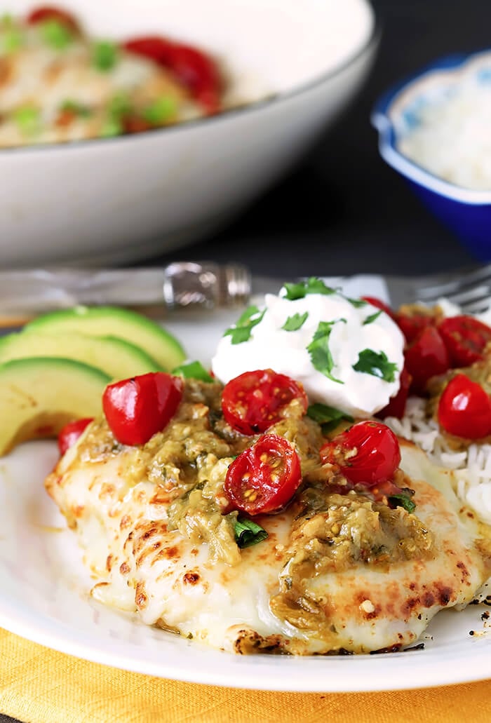 Tomatillo Salsa Verde Chicken Breasts Served with Cherry Tomatoes, Avocado and Sour Cream