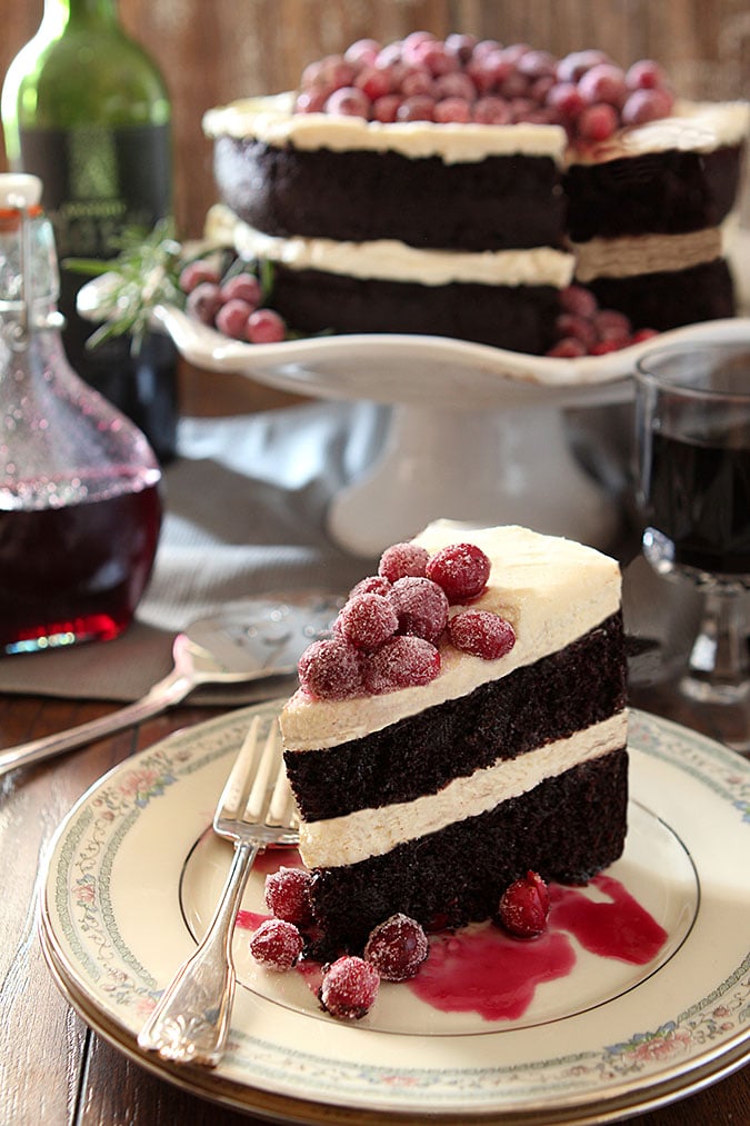 Chocolate Cake with Whipped Cream and Mascarpone Frosting Topped with Sugared Cranberries. The perfect cake for the Christmas holiday!