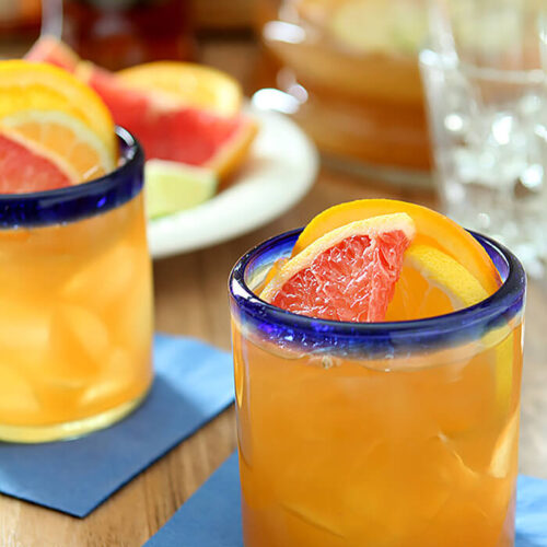 Citrus Rum Punch in Glasses with Blue Rim