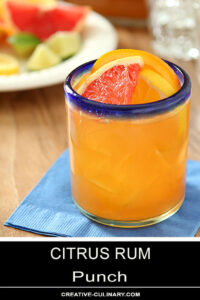 Glass of Citrus Rum Punch Garnished with Grapefruit and Orange Slices