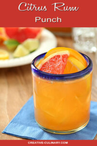 Glass of Citrus Rum Punch Garnished with Grapefruit and Orange Slices