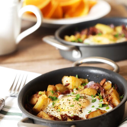 Corned Beef Hash on Table with Oranges and Coffee