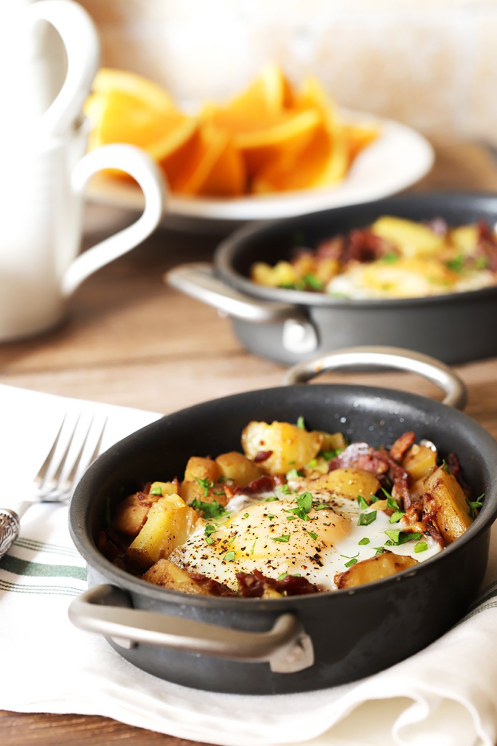 Corned Beef Hash on Table with Oranges and Coffee