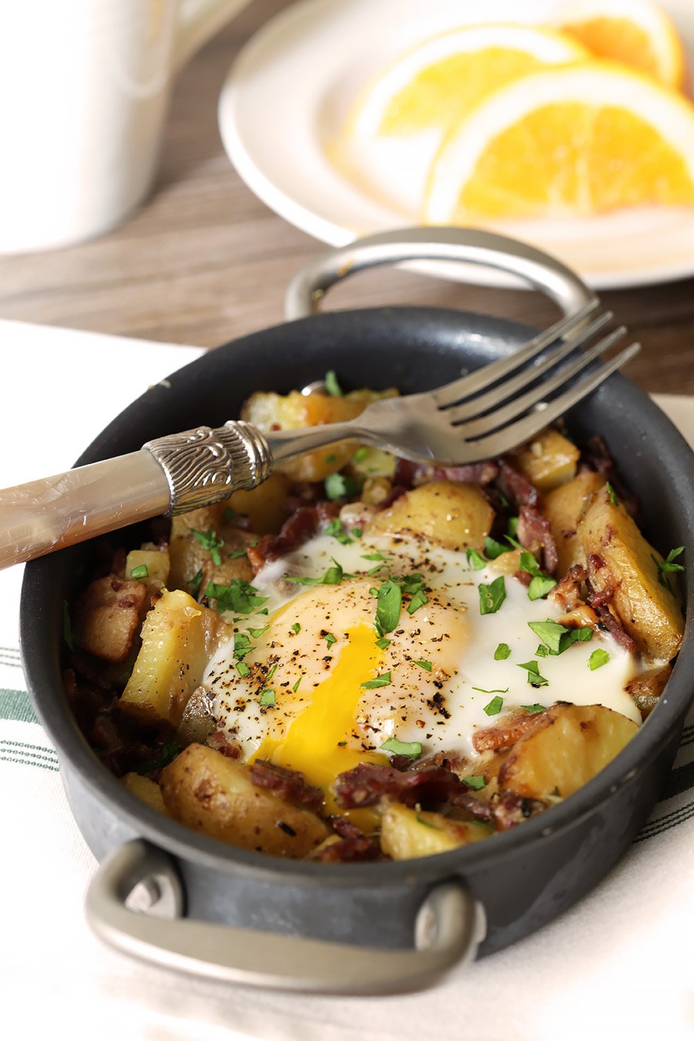 Corned Beef Hash with Bacon is Served in a Small Skillet.