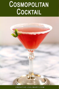 Cosmopolitan Pink Cocktail on Marble Table with Lime Garnish