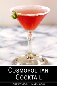 Cosmopolitan Pink Cocktail on Marble Table with Lime Garnish