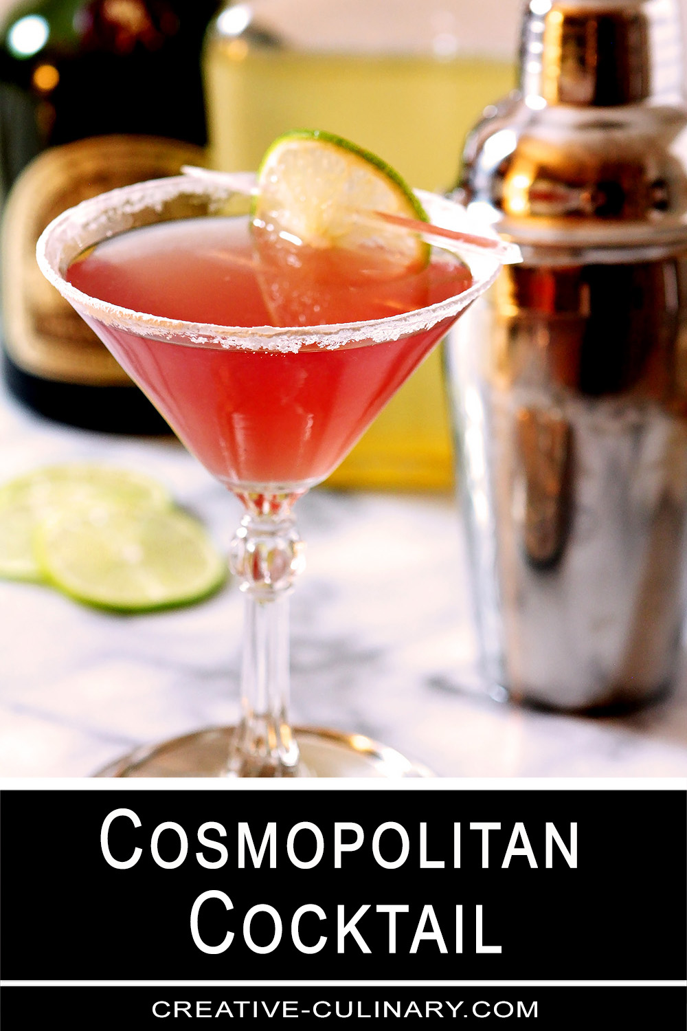 Cosmopolitan Cocktail on Marble Surface with Cocktail Shaker in Background.