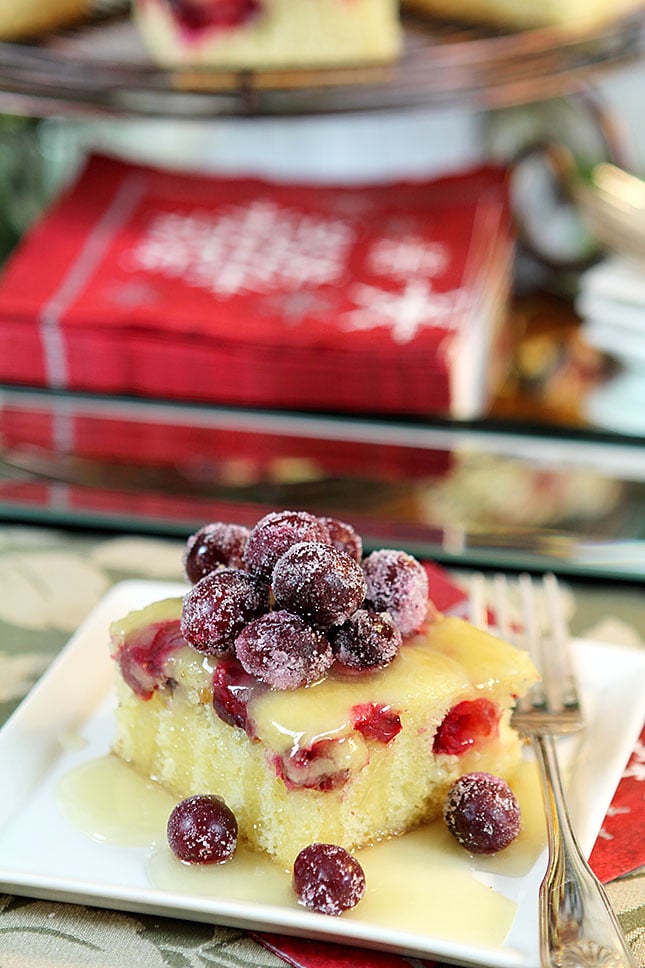 A Rum Butter Sauce is Served over Cranberry Cake and Topped with Sugared Cranberries