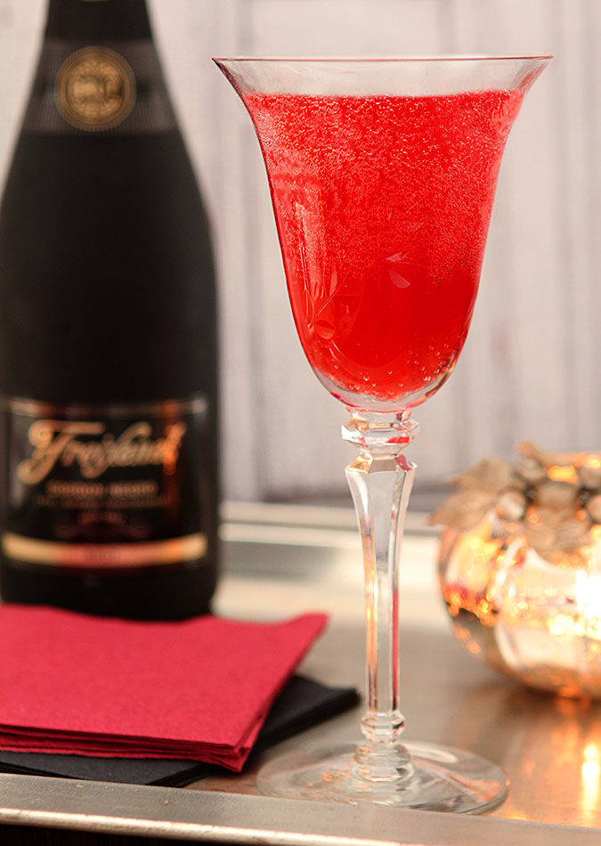 Cranberry Liqueur Champagne Cocktail in a Wine Glass