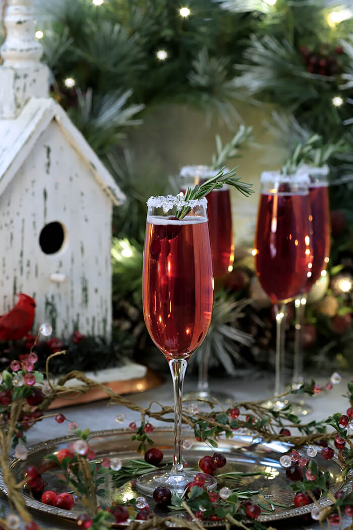 Set of four Tiffany Champagne Goblets with a Cranberry Pointsetta Cocktail