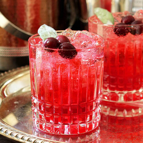 Cranberry Sage Cocktail with Cranberries and Sage Leaf Garnish