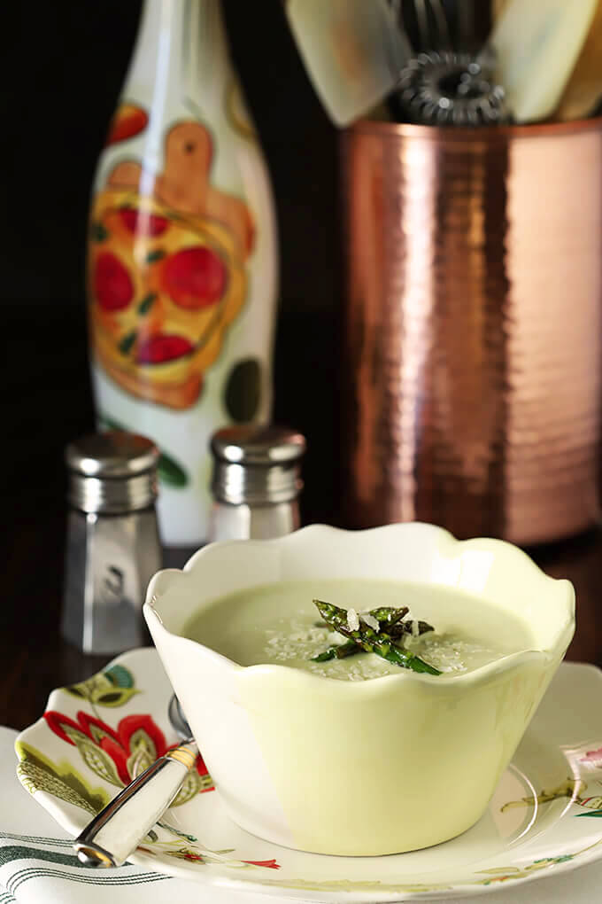 Cream of Roasted Asparagus Soup with Garlic & Parmesan in a Yellow and White Bowl