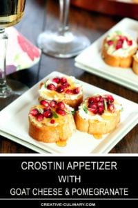 Crostini with Goat Cheese and Pomegranate Closeup on White Plate