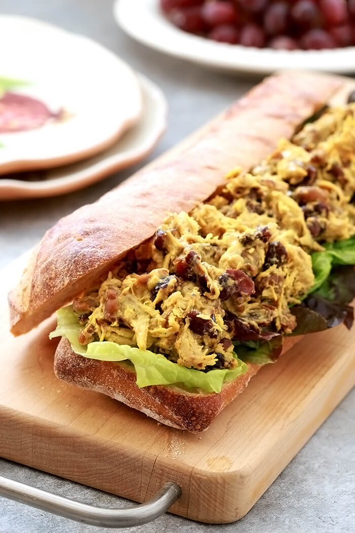 Curry Chicken Salad with Dried Cranberries and Walnuts on a Cutting Board