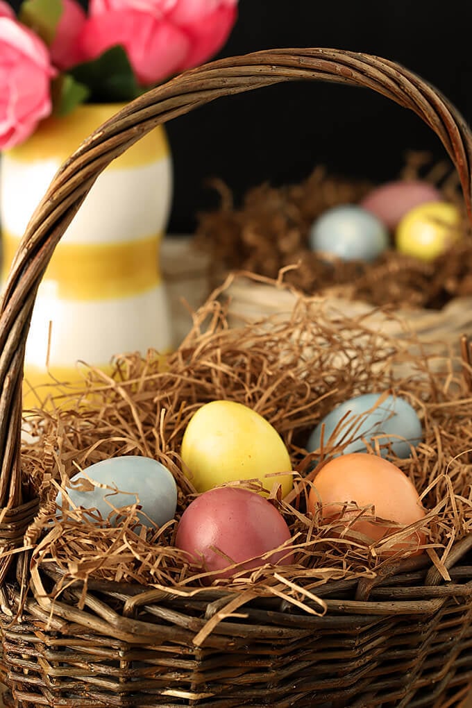 Decorated Easter Eggs with Organic Vegetables and Spices in an Easter Basket