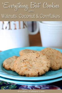 Everything But the Kitchen Sink Cookies with Walnuts, Coconut and Cornflakes on a Turquoise Plate