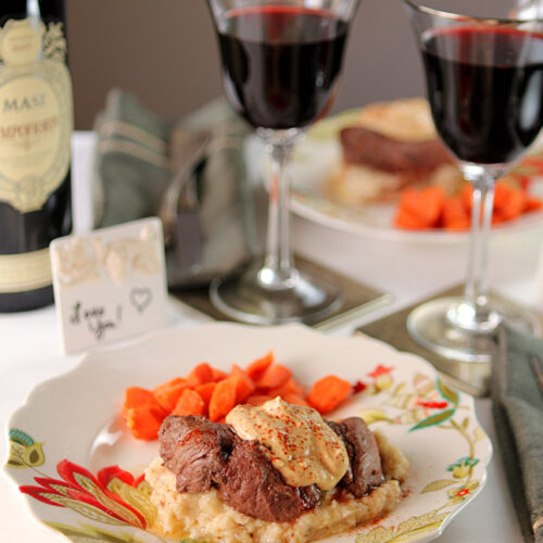 Filet with Horseradish Mustard and Cheddar Mashed Potatoes Served on a colorful plate.