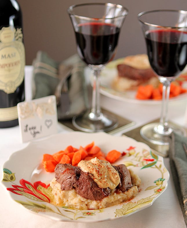 Filet with Horseradish Mustard and Cheddar Mashed Potatoes Served on a colorful plate.