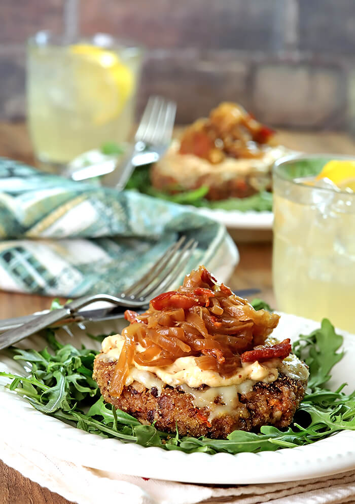 French Onion Veggie Burger with Caramelized Onions Served on ArugulaOnion Veggie Burger with Caramelized Onions Served on Arugula