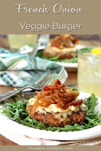 French Onion Veggie Burger with Caramelized Onions Served on Arugula