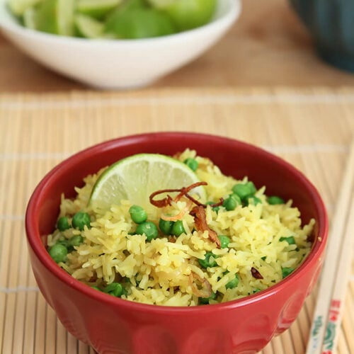 Crispy Shallots Fried Rice in Wok in Red Bowl with Lime Garnish