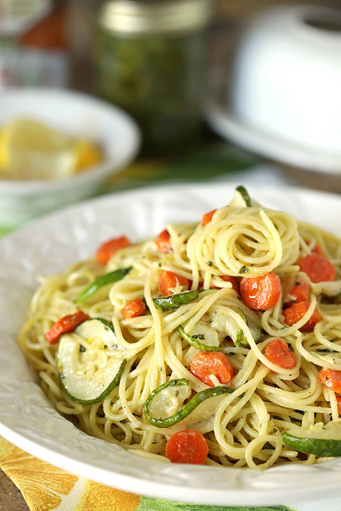 Garlic Pesto Pasta with Carrots and Zucchini in a White Serving Bowl