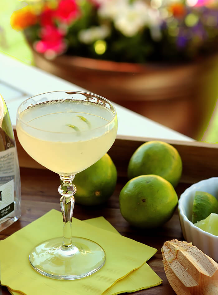 The Gimlet Cocktail Served Outdoors on a Wooden Tray