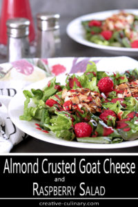 Goat Cheese and Raspberry Salad on a White Plate with Raspberry Dressing