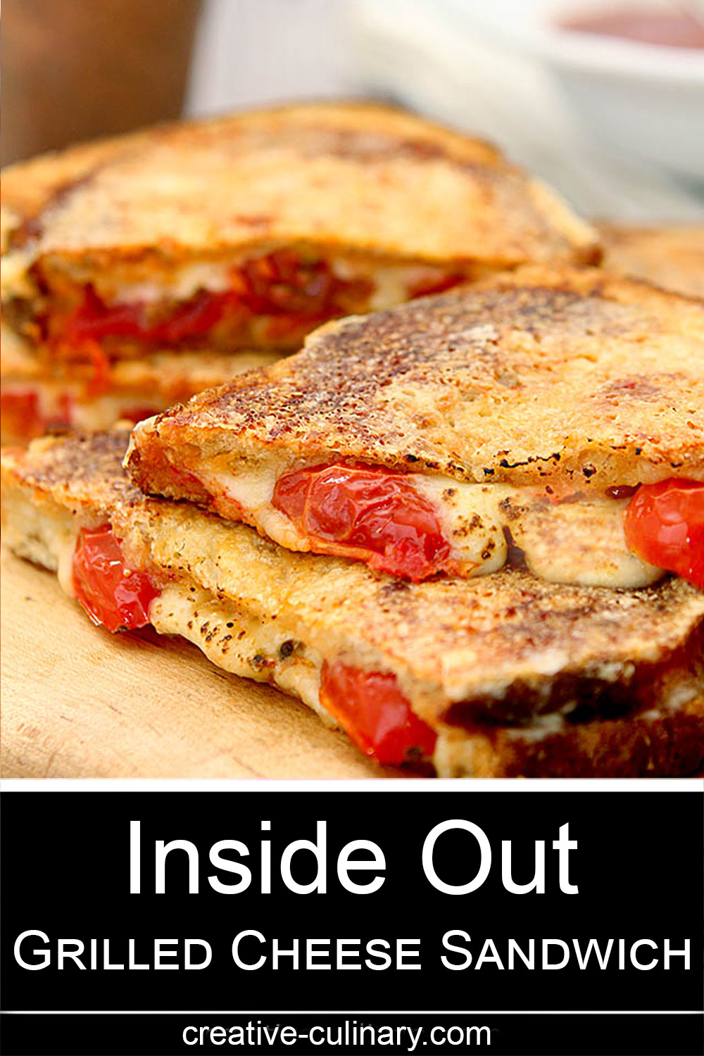 Inside Out Grilled Cheese Sandwich has cheese on the inside with baby tomatoes and more cheese grilled on the outside.