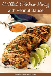 Grilled Chicken Thighs with Peanut Sauce on Serving Plate with Lime Wedges