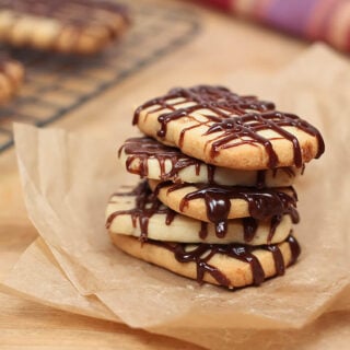 Stack of Heath Bread Shortbread Cookies with Chocolate Drizzle