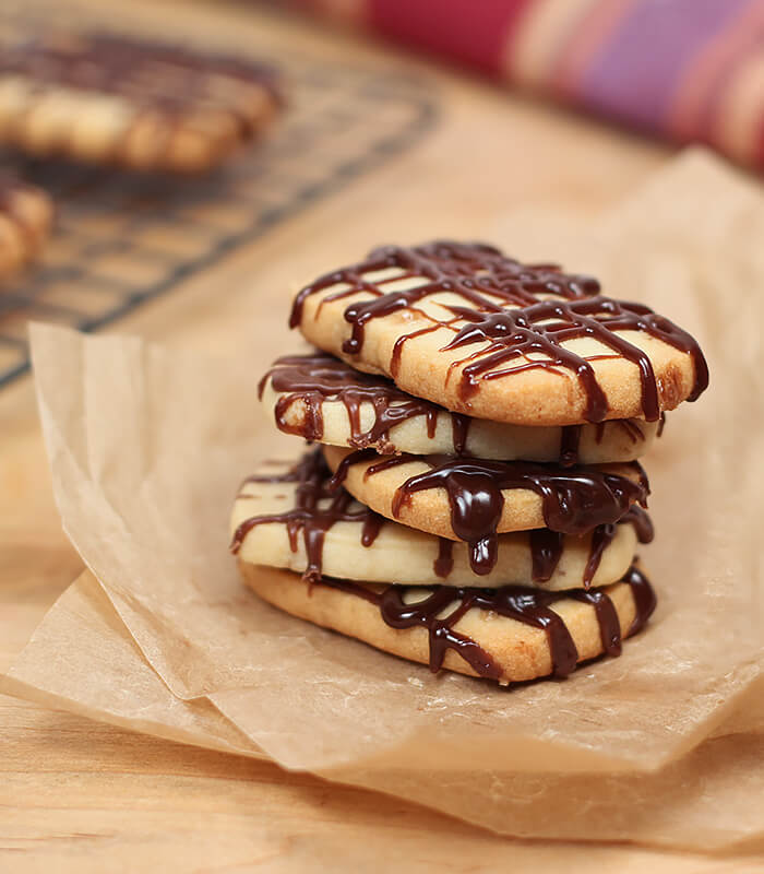 Stack of Heath Bread Shortbread Cookies with Chocolate Drizzle