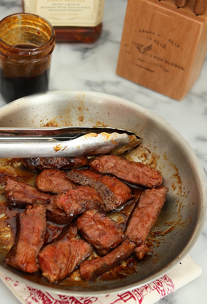 Jack Daniels Tennessee Honey Barbecue Sauce on Beef in a Skillet