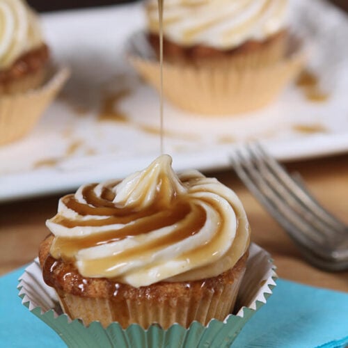 Closeup of Jack Daniels Honey Whiskey Cupcakes with a Boozy Drizzle from a Spoon