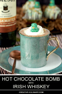 Prepared Hot Chocolate Bomb in Green Cup with Whipped Cream and Green Marshmallow Hat for Garnish