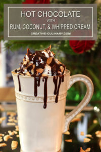 Closeup of Hot Chocoate with Rum, Coconut, and Chocolate Sauce in a Cream Color Mug