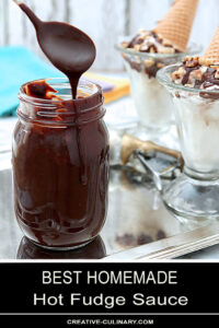 Best Hot Fudge Sauce in a Mason Jar with Sauce Drizzled From a Spoon