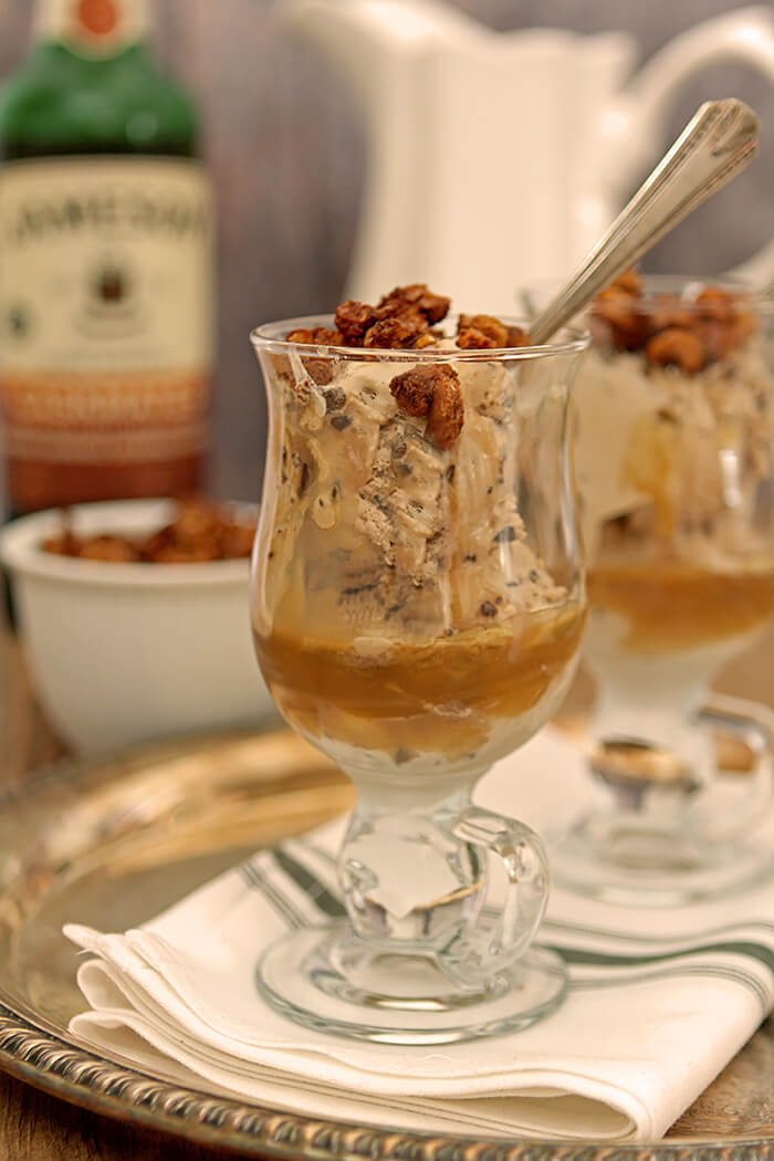 A glass mug of Irish Coffee Ice Cream with Caramel Sauce and Chocolate Chunks