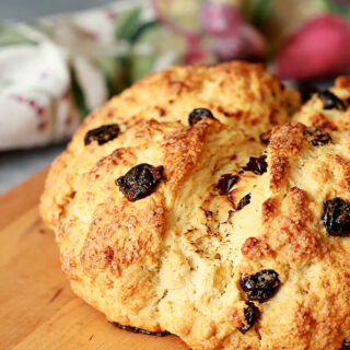 Irish Soda Bread with Tart Cherries Served on a Cutting Board