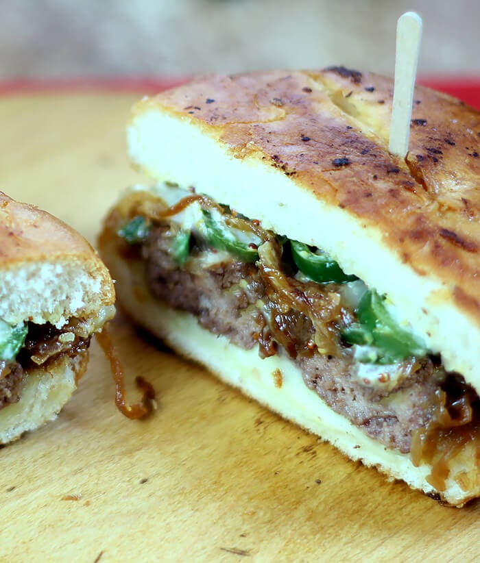 Jalapeno Patty Melt on a Board Cut in Half