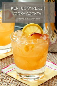 Kentucky Peach Vodka Cocktail in a Highball Glass and Garnished with Lemon and Peach Slices