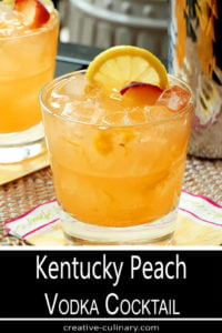 Kentucky Peach Vodka Cocktail in a Highball Glass and Garnished with Lemon and Peach Slices