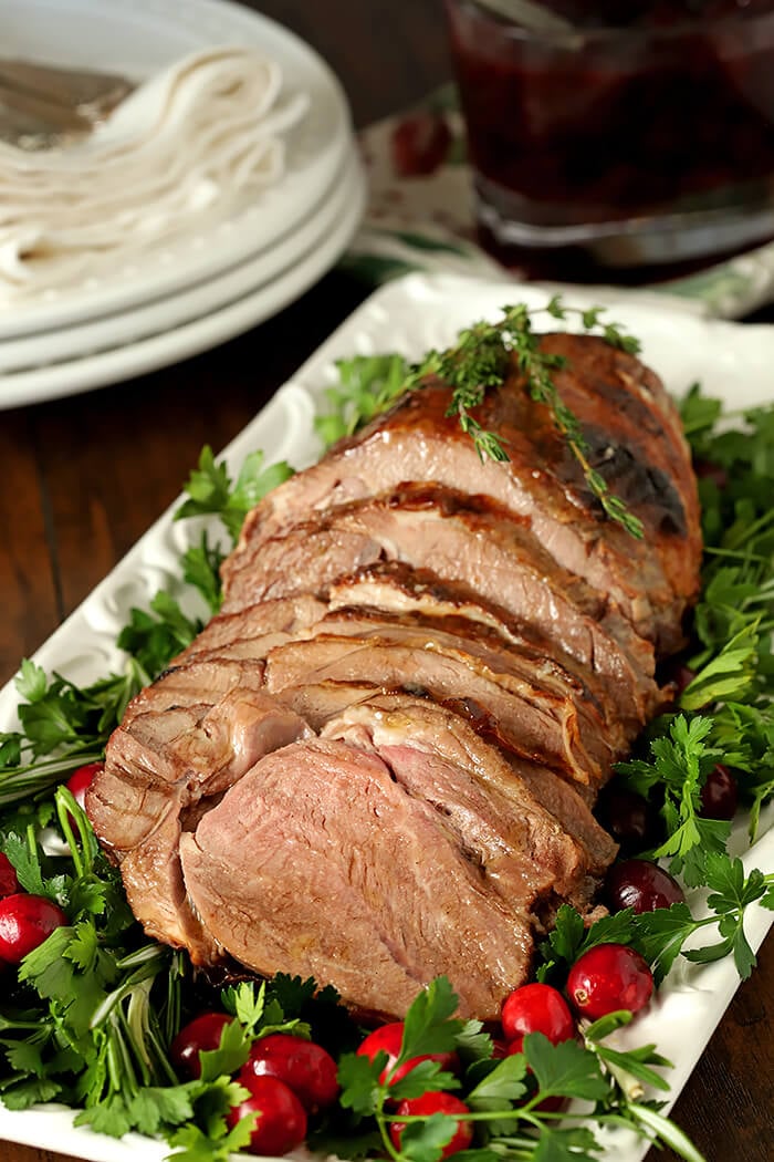 Honey Roasted Lamb with Honey and Thyme on White Serving Plate with Garnish