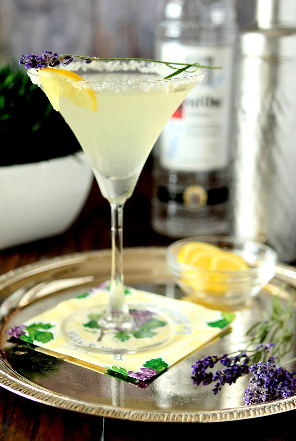 Lavender Lemonade Martini Cocktail on a Serving Tray with Lemon and Lavender as Garnish