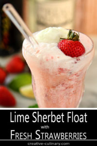 Closeup of Lime Sherbet Float with Strawberries and Prosecco in a Float Glass